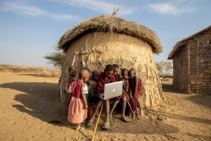 Local Kid outside their Manyatta at the Masai Mara National reserve